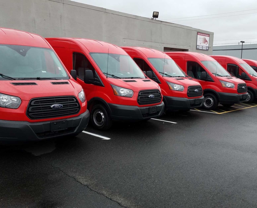 Advantage Outfitters Fleet Shots of red working vans