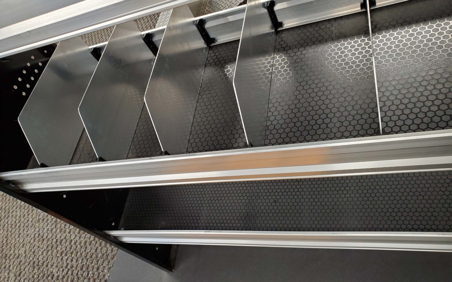 Double height shelf dividers installed in a work van