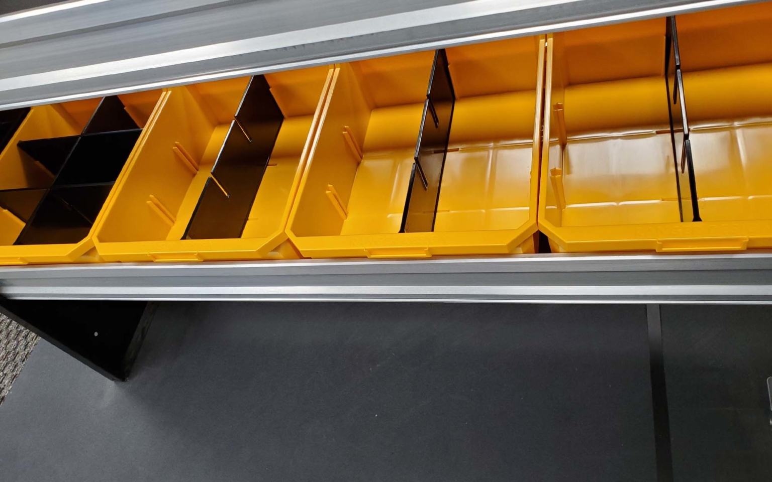 Yellow shelf bins with dividers