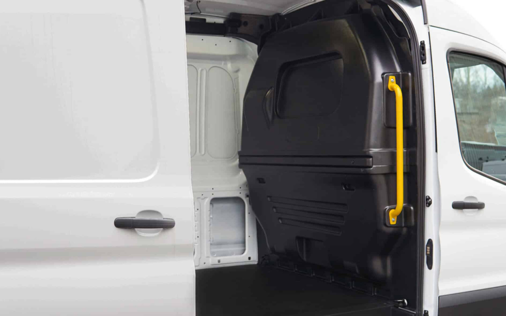 Side view of a composite partition installed in a work van