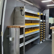 A van upfit with shelving and storage dividers