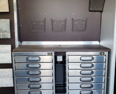 picture of a van upfit with drawers and caddies