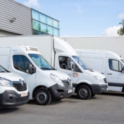 A fleet of different work vans
