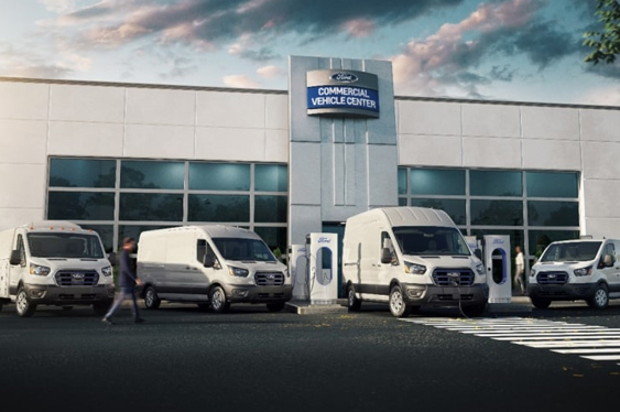 Fleet of upfitted commercial vans at a dealership’s vehicle center highlighting custom upfit capabilities.