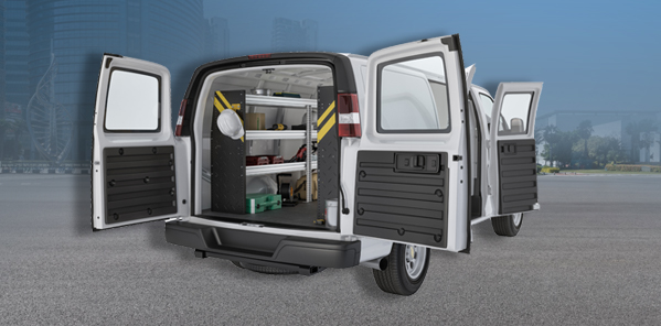 Securely equipped commercial van interior with tools and safety equipment for upfitting services