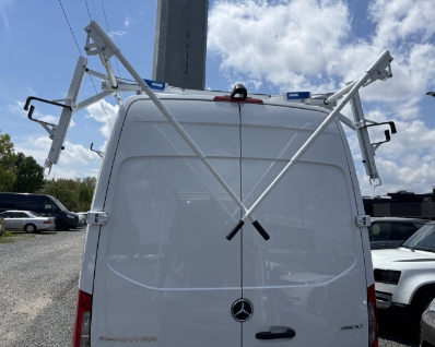 Back of sprinter with rack handles dropping down