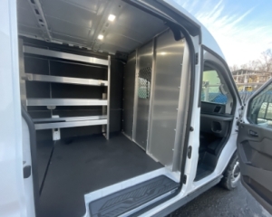 Packed shleving & patrition side view of white van