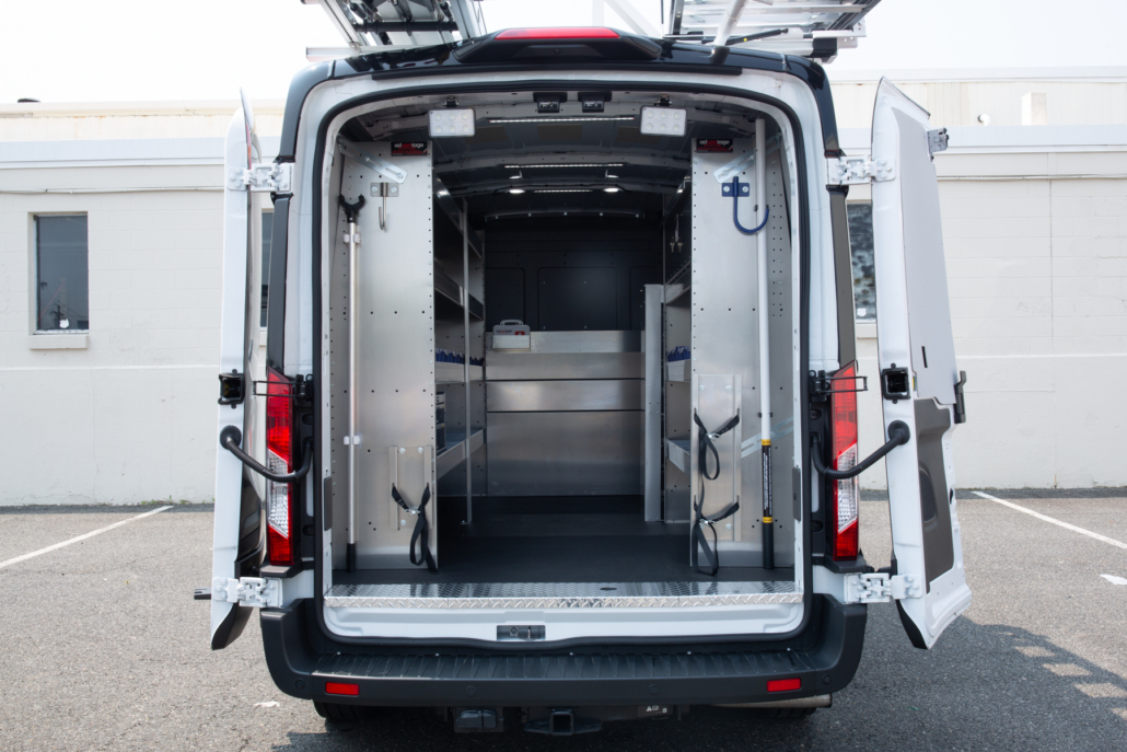 Packd shelving package in the back of a cargo van with the doors open.